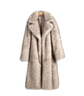 Beige fur coat on a hanger against a plain wall with a black chair in the corner.