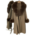 Beige coat with fur trim on a white background
