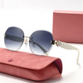 Sunglasses with quilted strap on a pink case against a white background