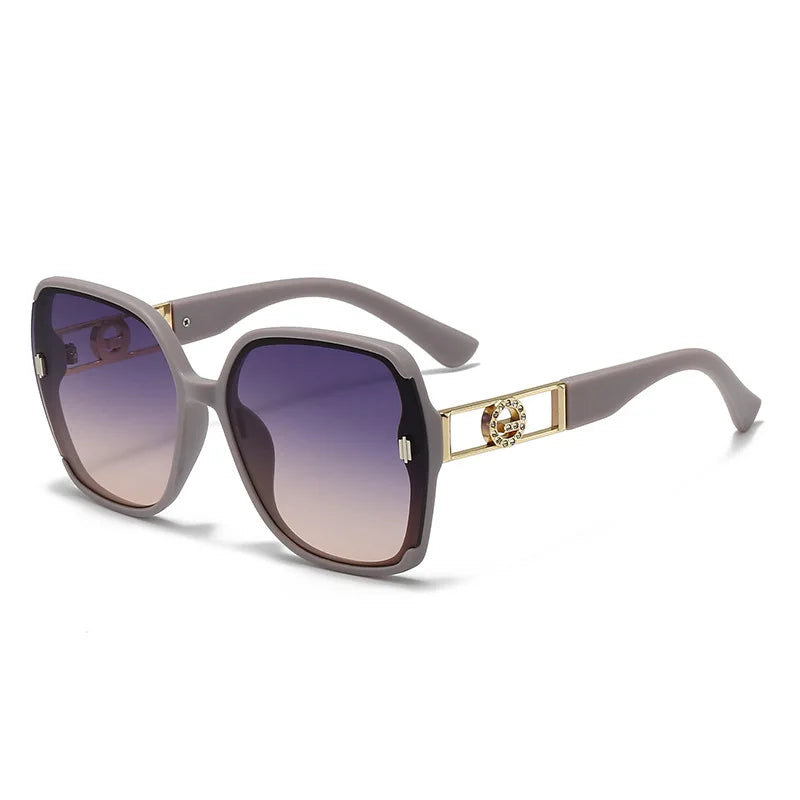 Sunglasses with gold accents on a white background