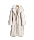 White fur coat on a hanger against a plain background