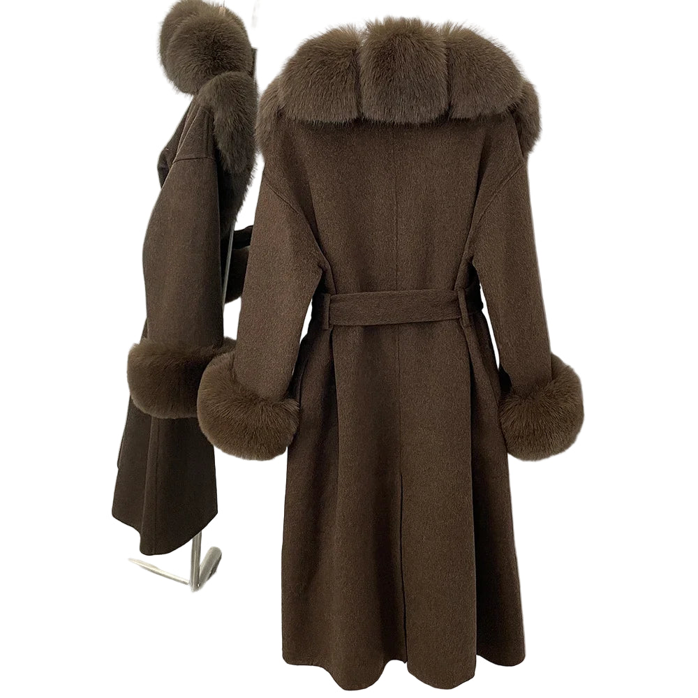 Brown coat with fur trim on a stand against a white wall