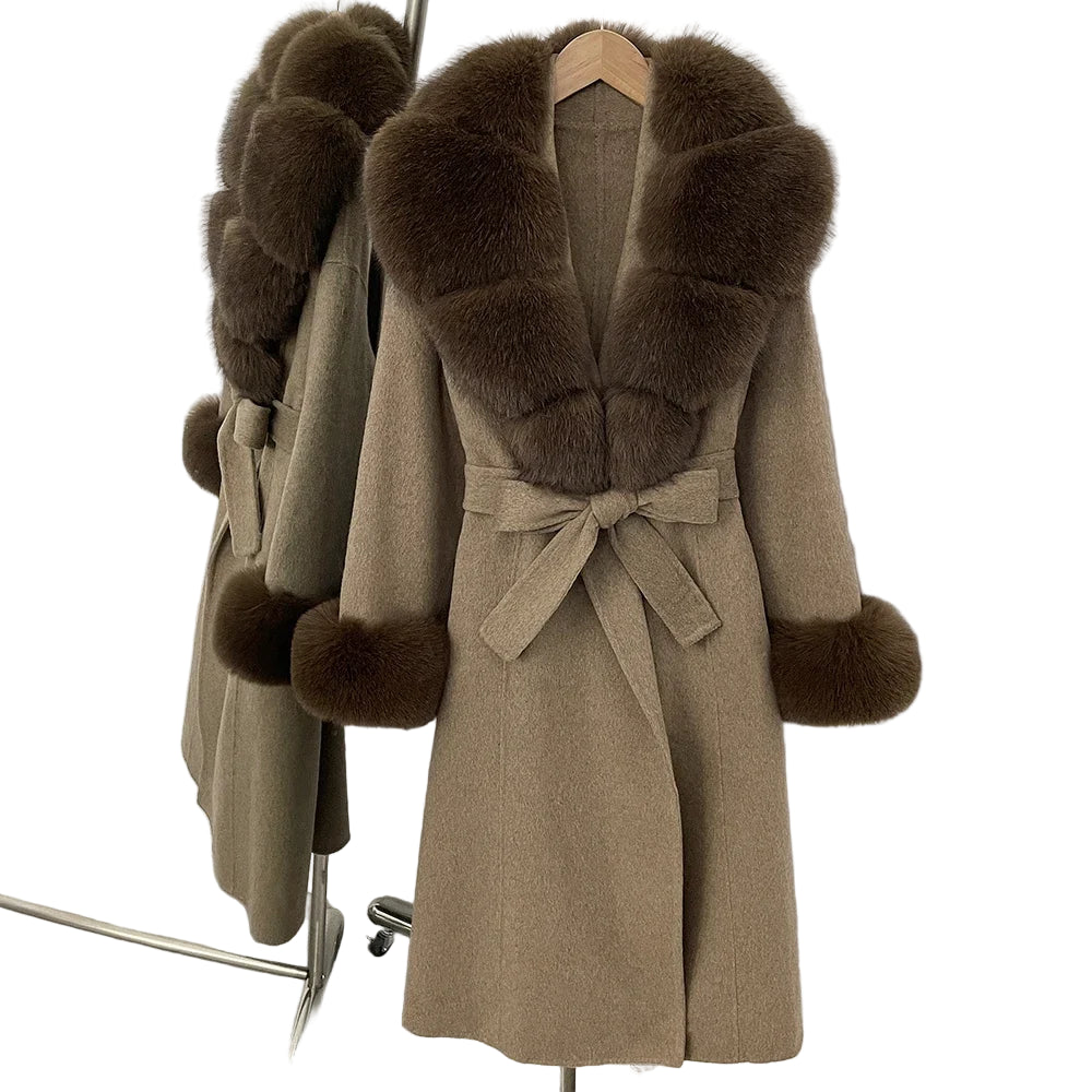 Brown coat with fur trim on a hanger against a white wall