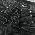 Black denim shorts with studded details and lace-up front.